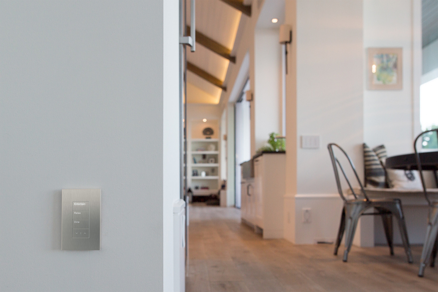 Elegant metallic finish on-wall keypad with four custom-engraved buttons.